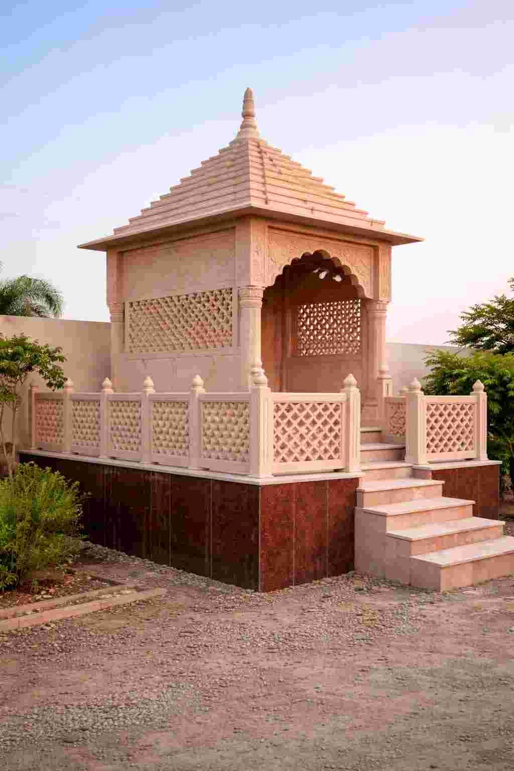 Pink sandstone temple with traditional carved facade